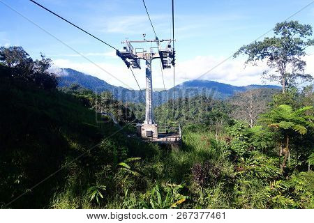 Genting Highlands, Malaysia - December 21 : Tourists Travel On Cable Car Of Genting Skyway. It Is A 