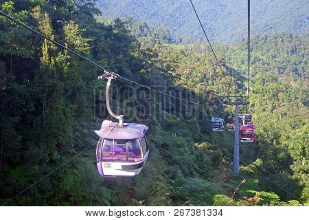 Genting Highlands, Malaysia - December 21 : Tourists Travel On Cable Car Of Genting Skyway. It Is A 