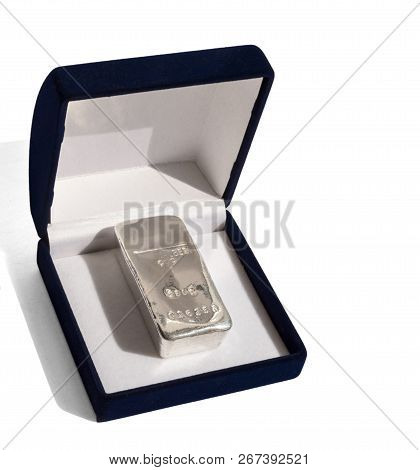 Cast Silver Bullion In A Velvet Gift Box. Isolated On A White Background. Silber Is Silver.