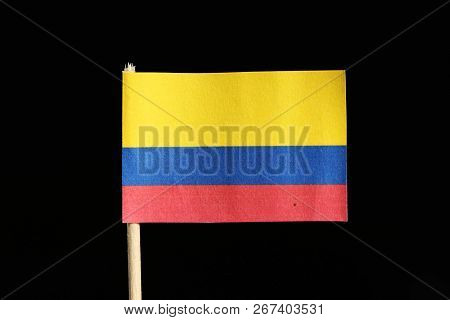 A National Flag Of Colombia On Toothpick On Black Background. A Horizontal Tricolour Of Yellow, Blue