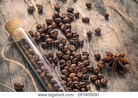 Coffee With Glass Flask And Clove On Grunge Wooden Background. Top View