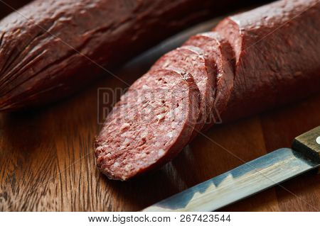 Sujuk (sucuk), A Dry Spicy Sausage On Wooden Background