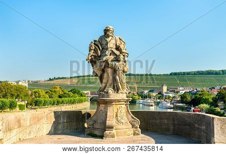 Statue Of Saint Joseph With Jesus On Alte Mainbrucke, The Old Bridge Across The Main River In Wurzbu