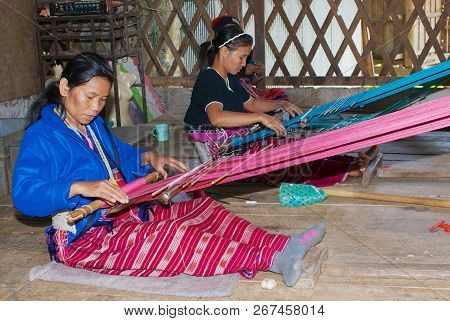 Doi Inthanon, Thailand - November 14, 2008: Unidentified Women Of The White Karen Hill Tribe Weaving