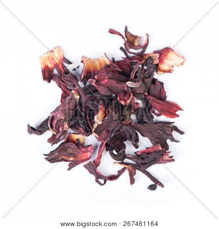 Heap of dried roselle flower tea carcade isolated on white