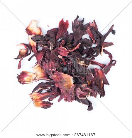 Heap of dried roselle flower tea carcade isolated on white