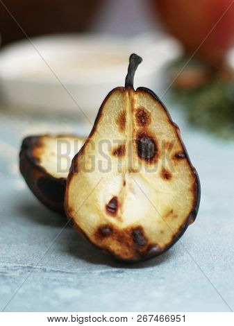 A Detail Image Of A Roasted, Charred Pear