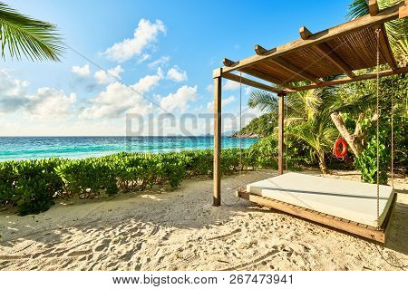 Luxury Wooden Lounge Beds On A Beautiful Mahe Beach, Seychelles