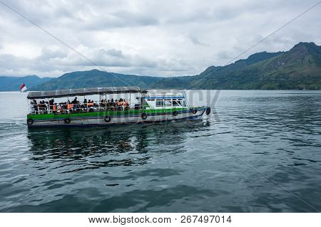 Lake Toba Is A Large Natural Lake Occupying The Caldera Of A Supervolcano, Located In The Middle Of 