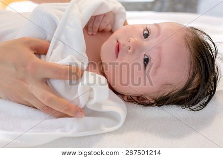 Baby Boy Taking A Bath In A Little Bath Tub