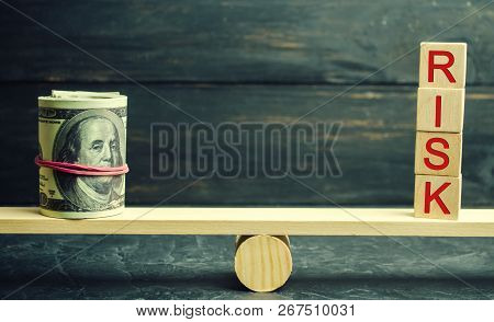Dollars And The Inscription Risk Are On The Scales. The Concept Of Financial And Economic Risk. Unre