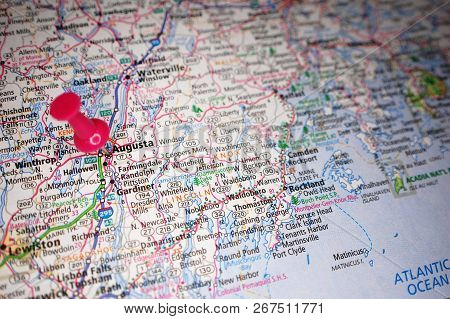 A Map Of Augusta, Maine Marked With A Push Pin.