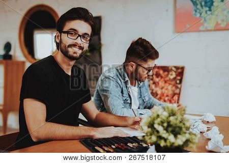Two Talanted Artist Freelancer Painting Indoors. Portrait Of Painters Sitting At Table Focused On Ar