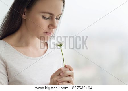 Closeup Portrait Of Girl With Chamomile Flower, Young Woman With Natural Make-up Smiling, Background