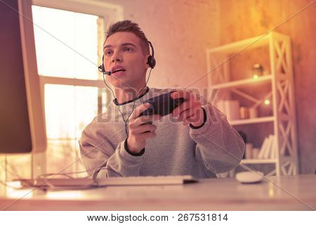 Engrossed Gamer Concentrating On The Video Game