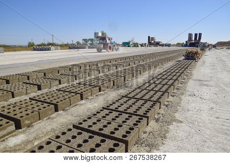 Cinder Blocks Lie On The Ground And Dried. On Cinder Block Production Plant