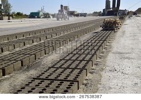 Cinder Blocks Lie On The Ground And Dried. On Cinder Block Production Plant