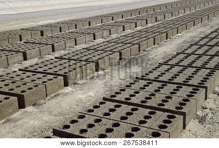 Cinder Blocks Lie On The Ground And Dried. On Cinder Block Production Plant