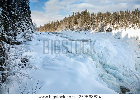 frozen waterfall Tannforsen in winter, Sweden