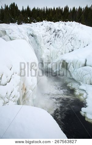 frozen waterfall Tannforsen in winter, Sweden