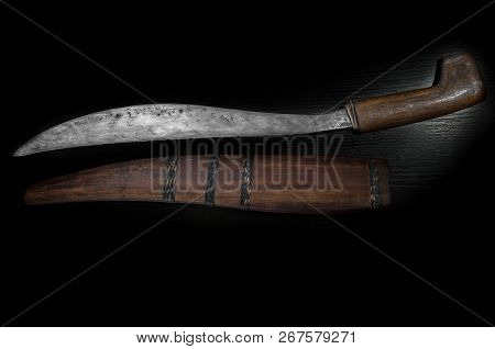 Old Curve Combat Knife, Scimitar, Curved Blade, Wooden Handle On Black Isolated Background