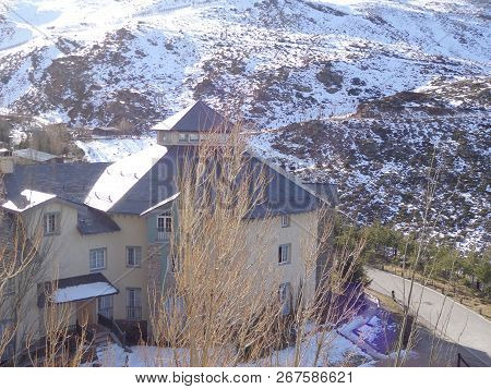 Small Snowy Village On A Sunny Winter Day