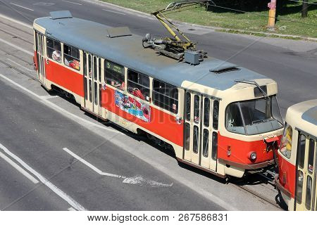 Bratislava, Slovakia - August 9, 2012: People Ride A Tram In Bratislava, Slovakia. Tram Operator Dpb