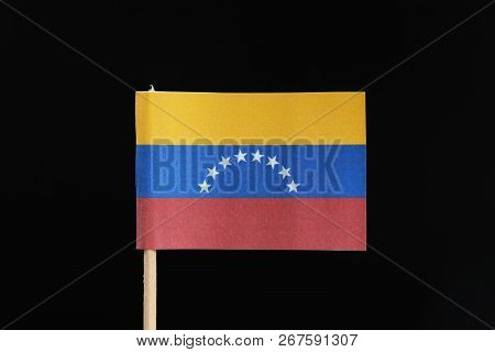 A Official And Original Flag Of Venezuela  On Toothpick On Black Background. A Horizontal Tricolor O