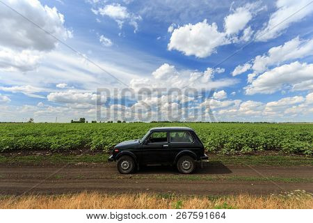 Dnipropetrovsk Region, Ukraine - July 08, 2017: Vaz Niva Blue-green Color On The Dirt Road Near The 