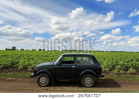 Dnipropetrovsk Region, Ukraine - July 08, 2017: Vaz Niva Blue-green Color On The Dirt Road Near The 