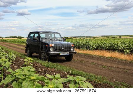 Dnipropetrovsk Region, Ukraine - July 08, 2017: Vaz Niva Blue-green Color On The Dirt Road Near The 