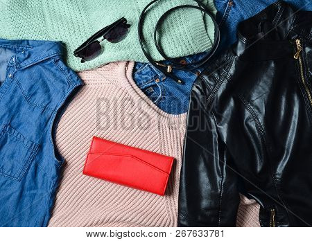 A Lot Of Diverse Women's Clothing And Accessories. Sweater, Denim Shirt, Jeans, Leather Jacket, Purs
