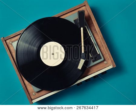 Retro Vinyl Player On A Blue Background. Entertainment 70S. Listen To Music. Top View.