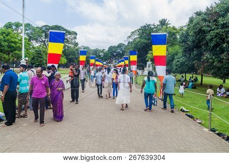 Kandy, Sri Lanka - July 19, 2016: White Clothed Buddhist Devotees At The Grounds Of The Temple Of Sa