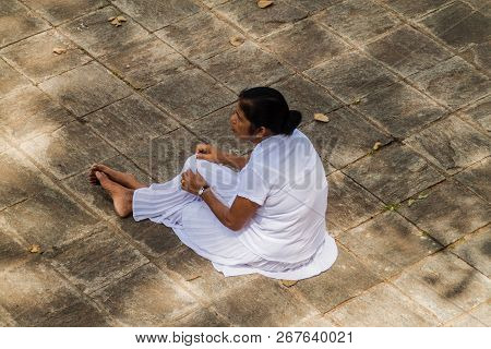 Kandy, Sri Lanka - July 19, 2016: White Clothed Buddhist Pilgrim During Poya Full Moon Holiday In Ka