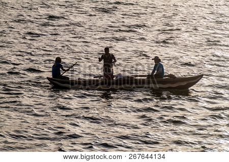 Polonnaruwa, Sri Lanka - July 22, 2016: Fishermen In A Boat At Topa Wewa Parakrama Samudra Lake Near