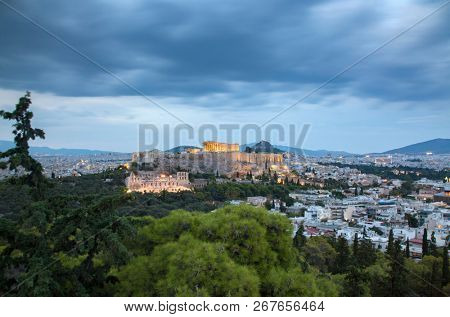 athens seen from Philopapou hill with views to Herodium , Acropolis and the Parthenon at blue hour, Attica, Greece