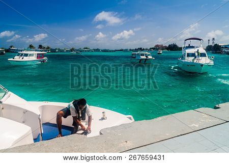 Hulhule Island, Maldives - July 11, 2016: Boats At The Harbor Next To Ibrahim Nasir International Ai
