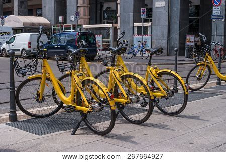 Milan, Italy - 09 May 2018: Yellow Bikemi Bicycles For Rent In A Parking Spot