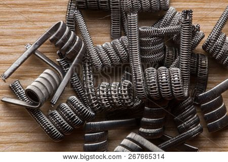 A Close-up Texture Of A Spiral For An Electronic Vaporizer And A Cigarette. Vape, Vaping