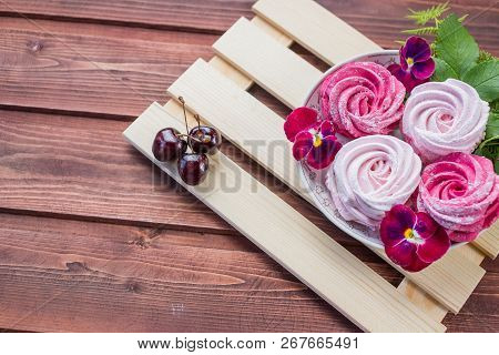 Pink Homemade Zephyr Or Marshmallow With Cherry Berry And Flowers On Light Wooden Background. Marshm