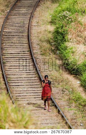 Haputale, Sri Lanka - July 16, 2016: Local Woman Walks On Railway Tracks Near Haputale.
