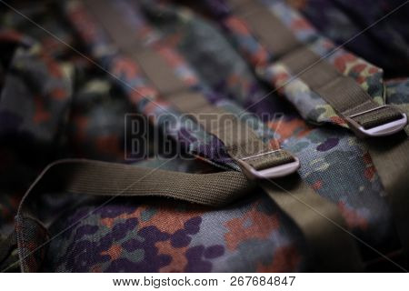 Military Camouflage Roomy Backpack. In The Frame Of The Strap And The Back Of A Backpack. Close-up V