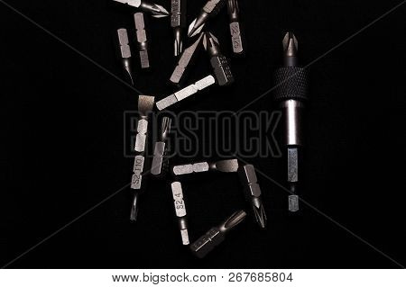 Tool Carbon Steel Bits With Bit Holder On Black Background In Dark Key Style.