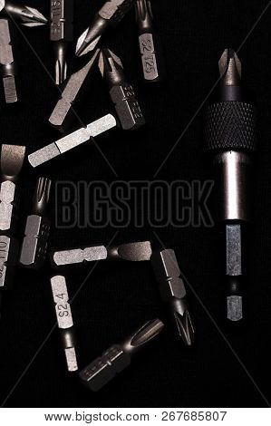 Tool Carbon Steel Bits With Bit Holder On Black Background In Dark Key Style.