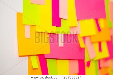 Bright Multi-colored Stickers On The Office White Board.