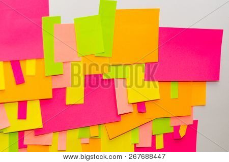 Bright Multi-colored Stickers On The Office White Board.