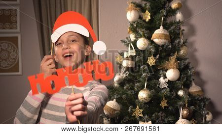 Girl Holding Banners With Words Hohoho Like Santa Says