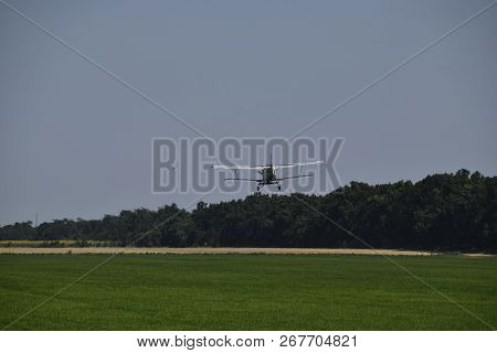Aircraft Agricultural Aviation An-2. Landing On The Field For Filling Fertilizers An-2.