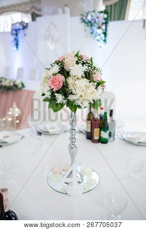Decor With Flowers, Number, Botles, Dishes On The Table